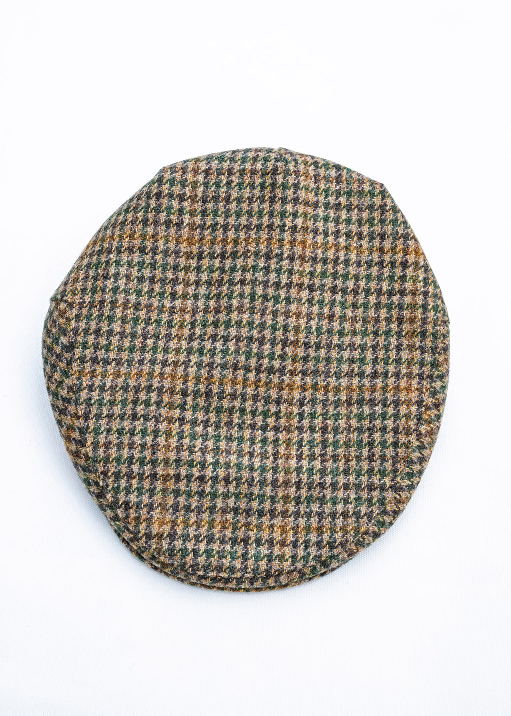 Houndstooth patterned flat cap on a white background