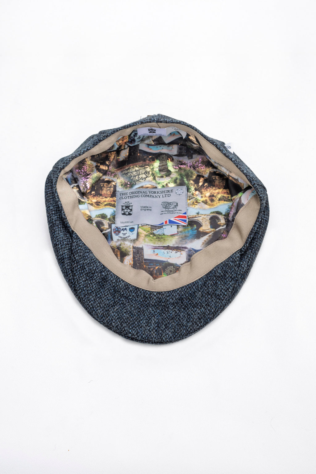 Blue fabric bag with a collage of Ilkley images inside on a white background