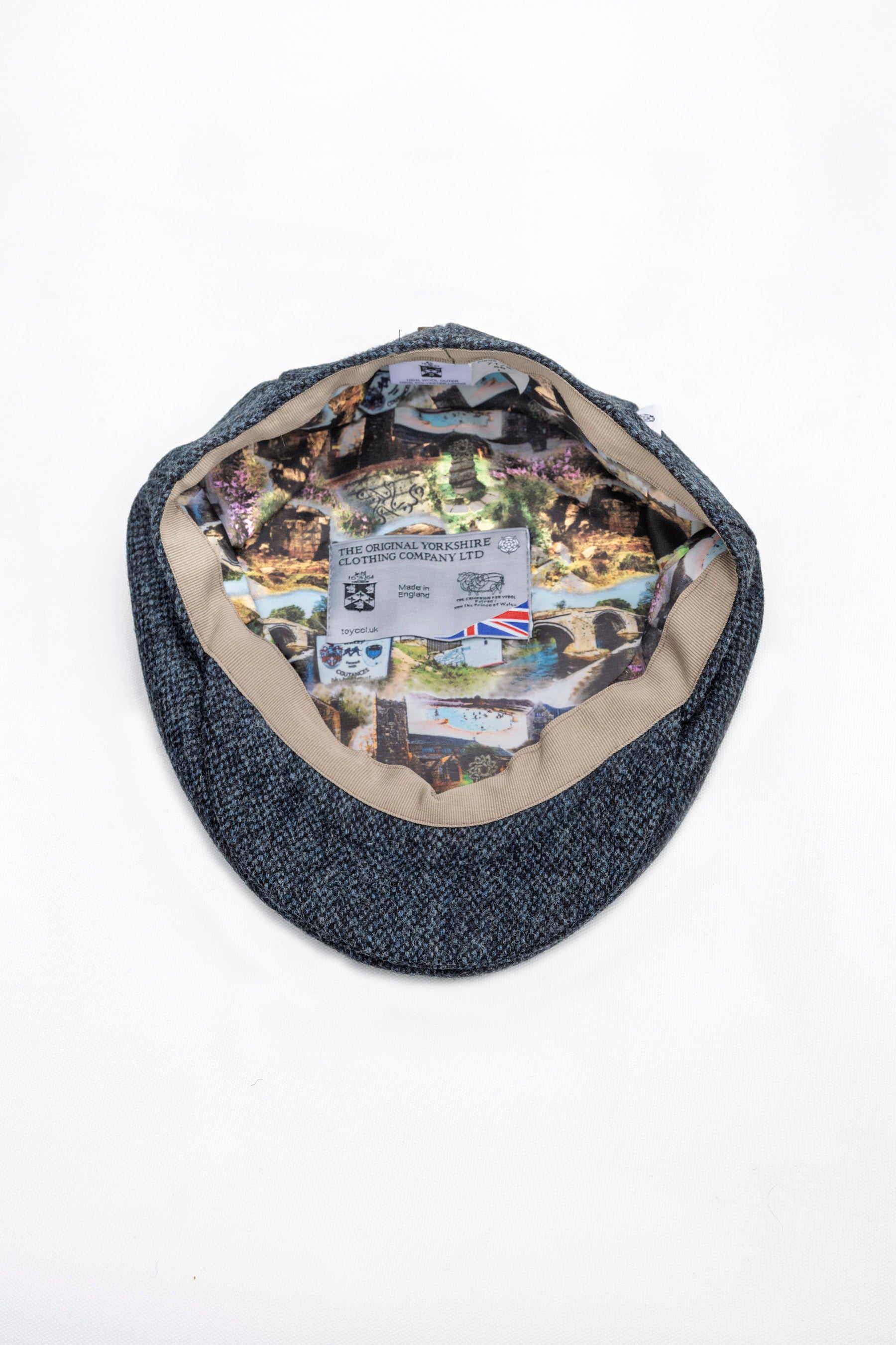 Blue fabric bag with a collage of Ilkley images inside on a white background