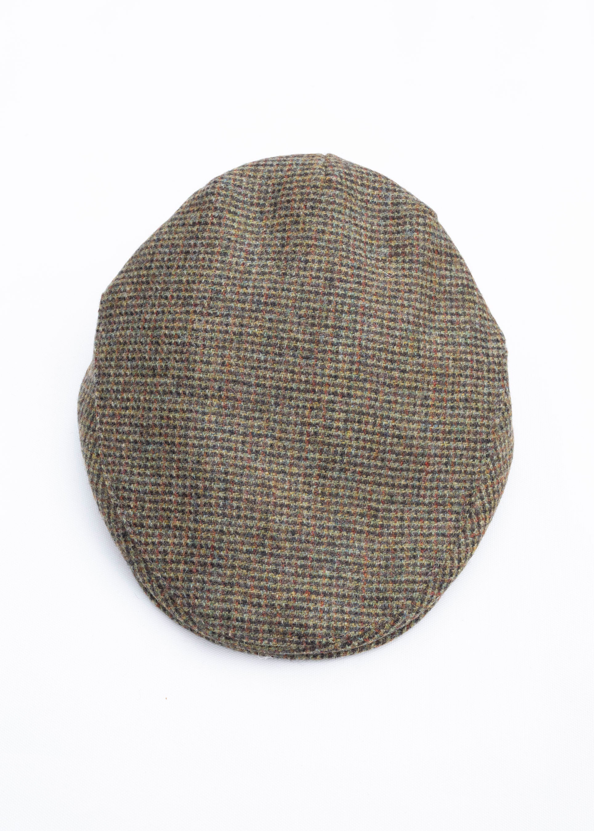 Herringbone patterned flat cap on a white background