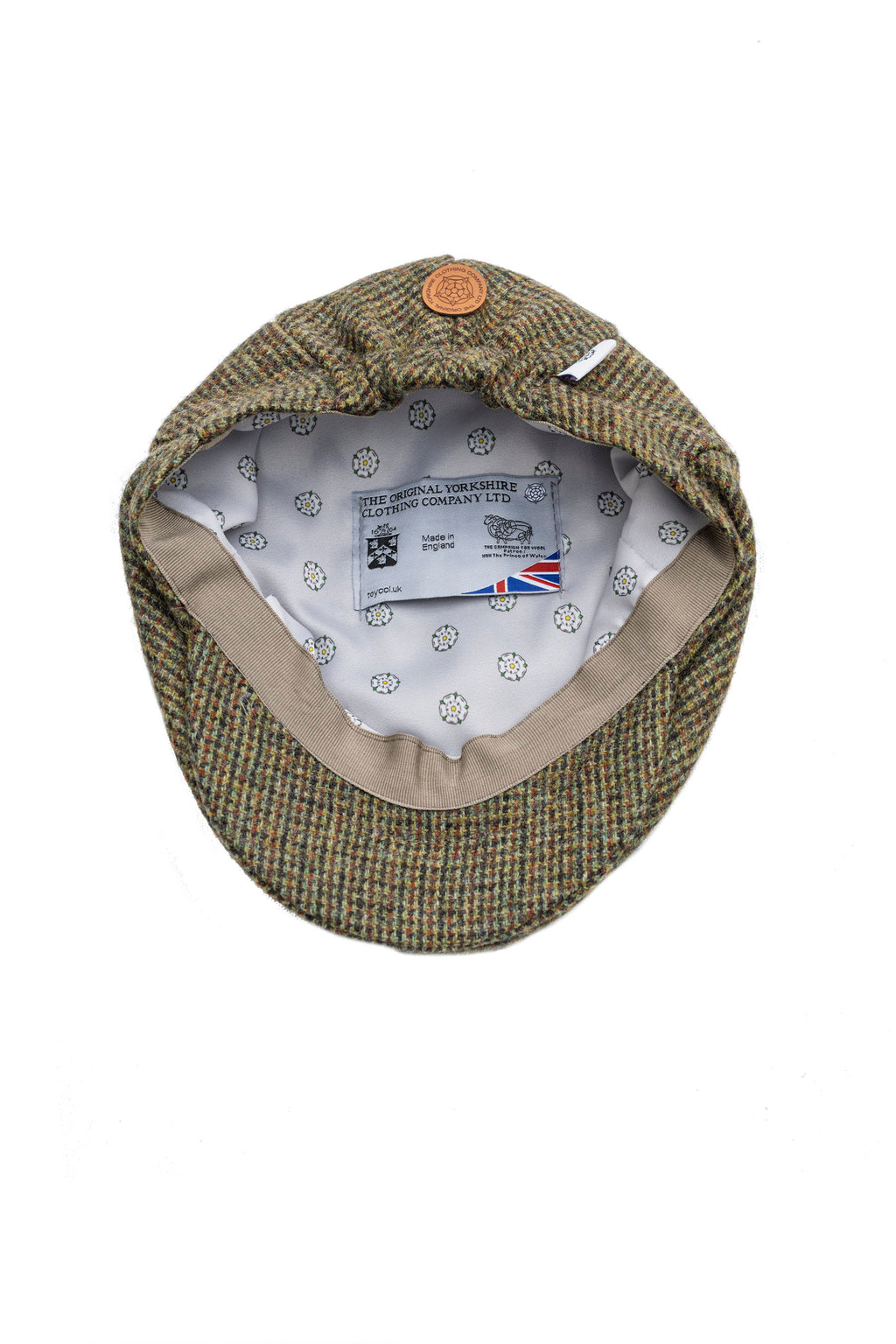 Green checkered flat cap with brand label on a white background